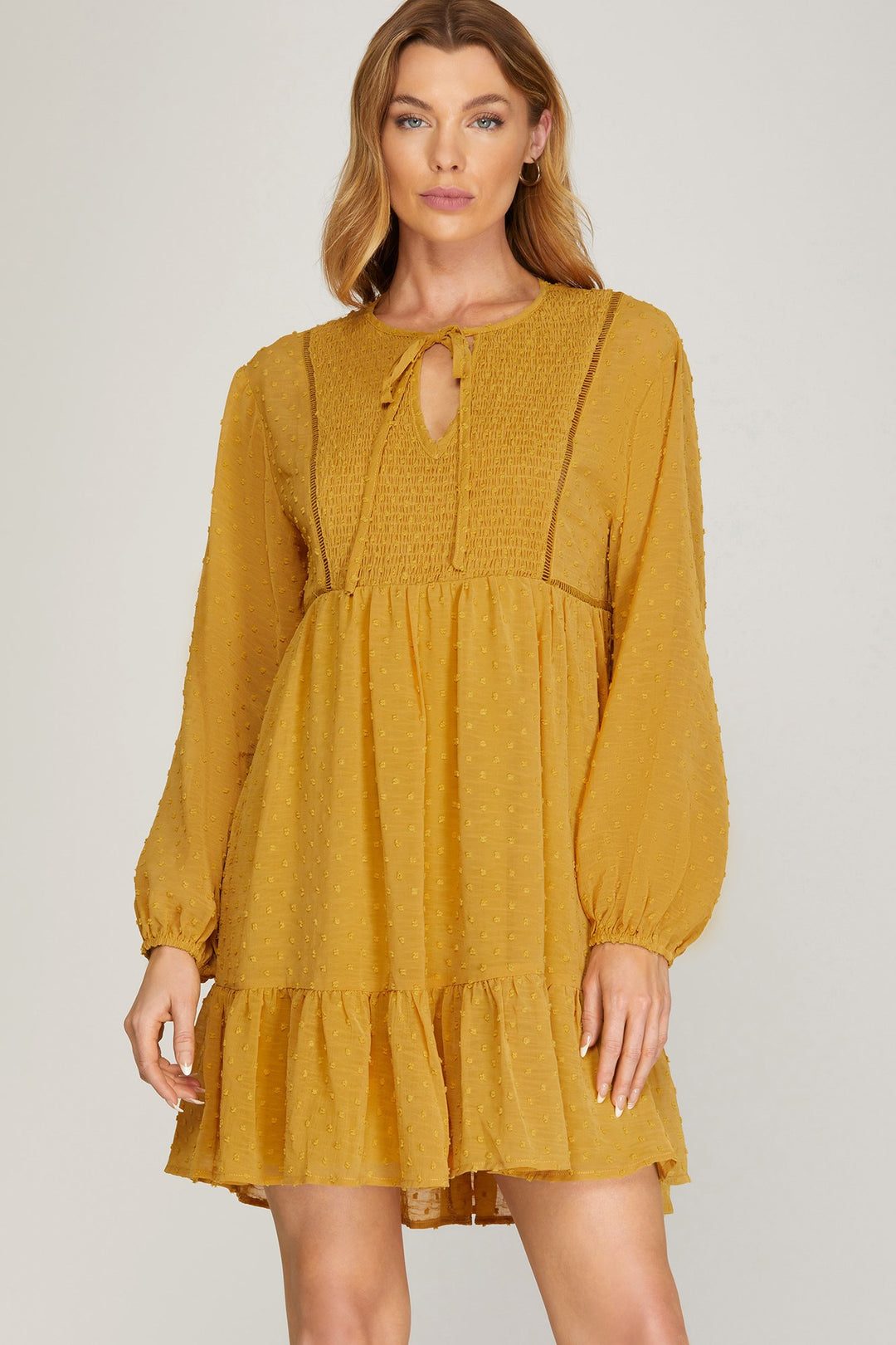 LONG SLEEVE SWISS DOT DRESS WITH SMOCKED DETAIL AND FRONT NECK TIE