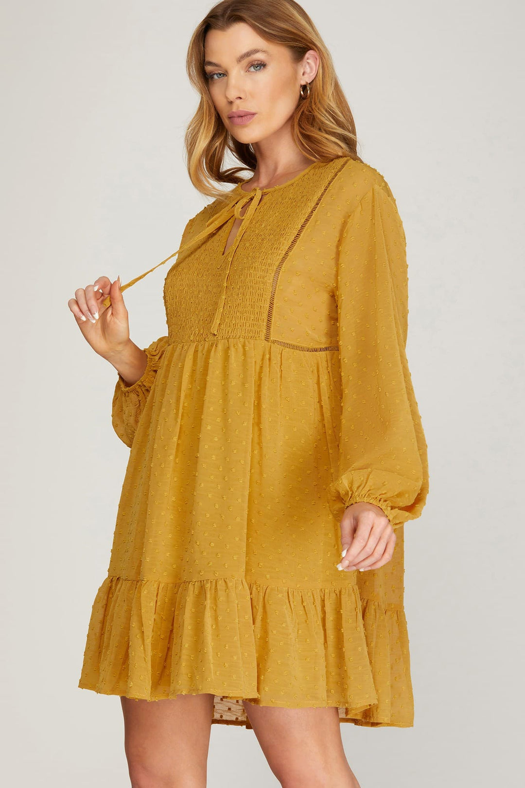 LONG SLEEVE SWISS DOT DRESS WITH SMOCKED DETAIL AND FRONT NECK TIE