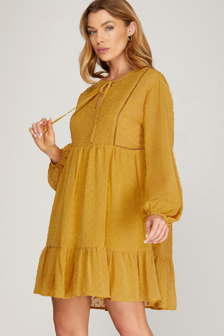 LONG SLEEVE SWISS DOT DRESS WITH SMOCKED DETAIL AND FRONT NECK TIE