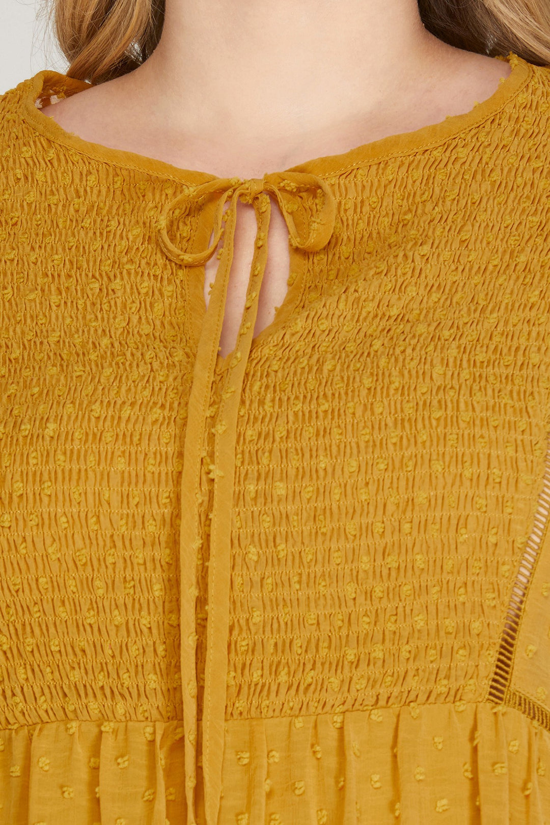 PLUS - LONG SLEEVE SWISS DOT DRESS WITH SMOCKED DETAIL AND FRONT NECK TIE