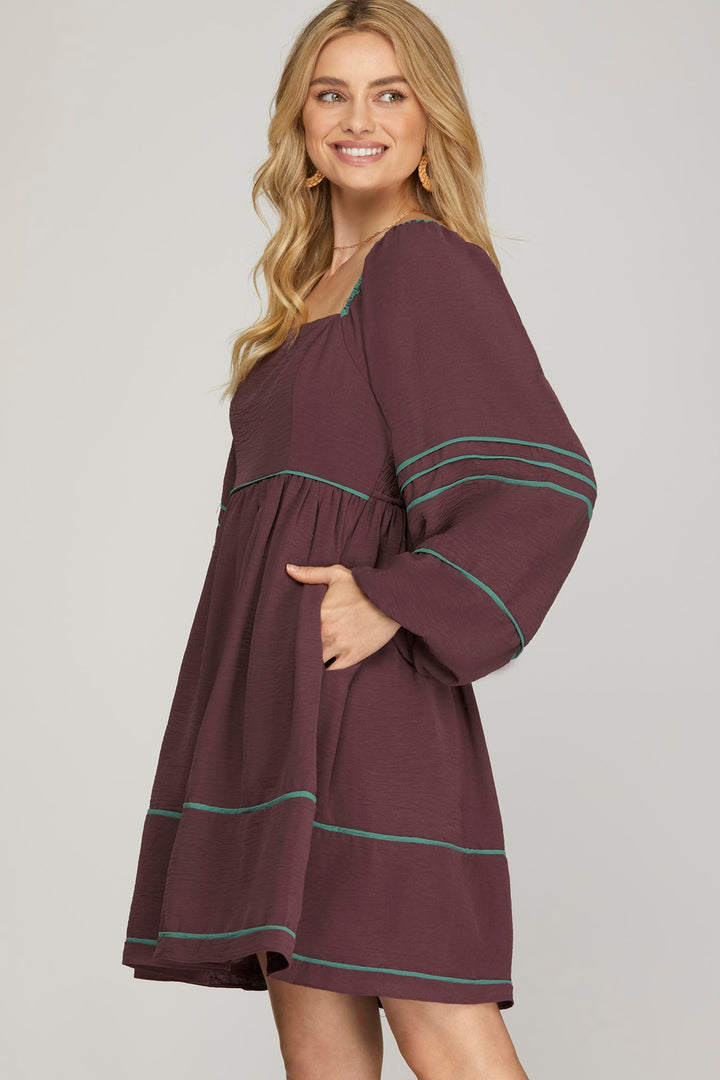 LONG SLEEVE WOVEN DRESS WITH CONTRAST BINDING DETAIL WITH SIDE POCKETS