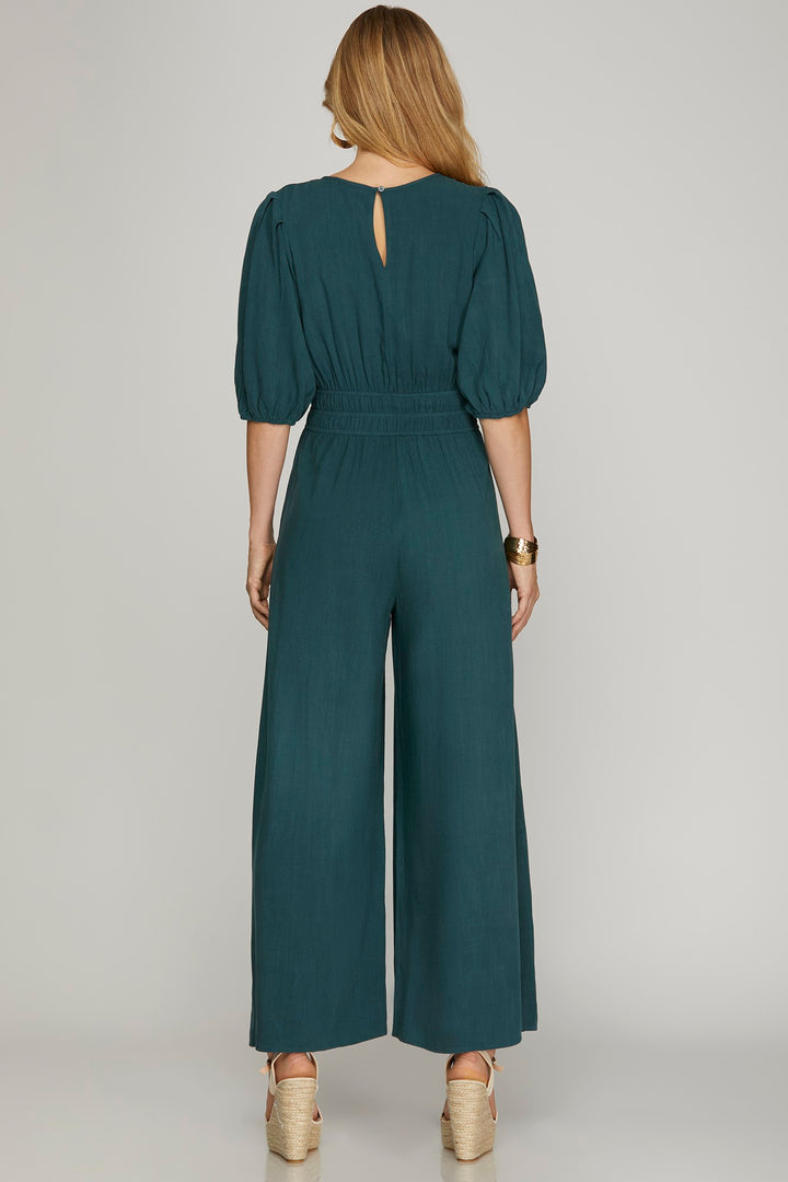 HALF SLEEVE SMOCKED WAIST WOVEN JUMPSUIT WITH POCKETS