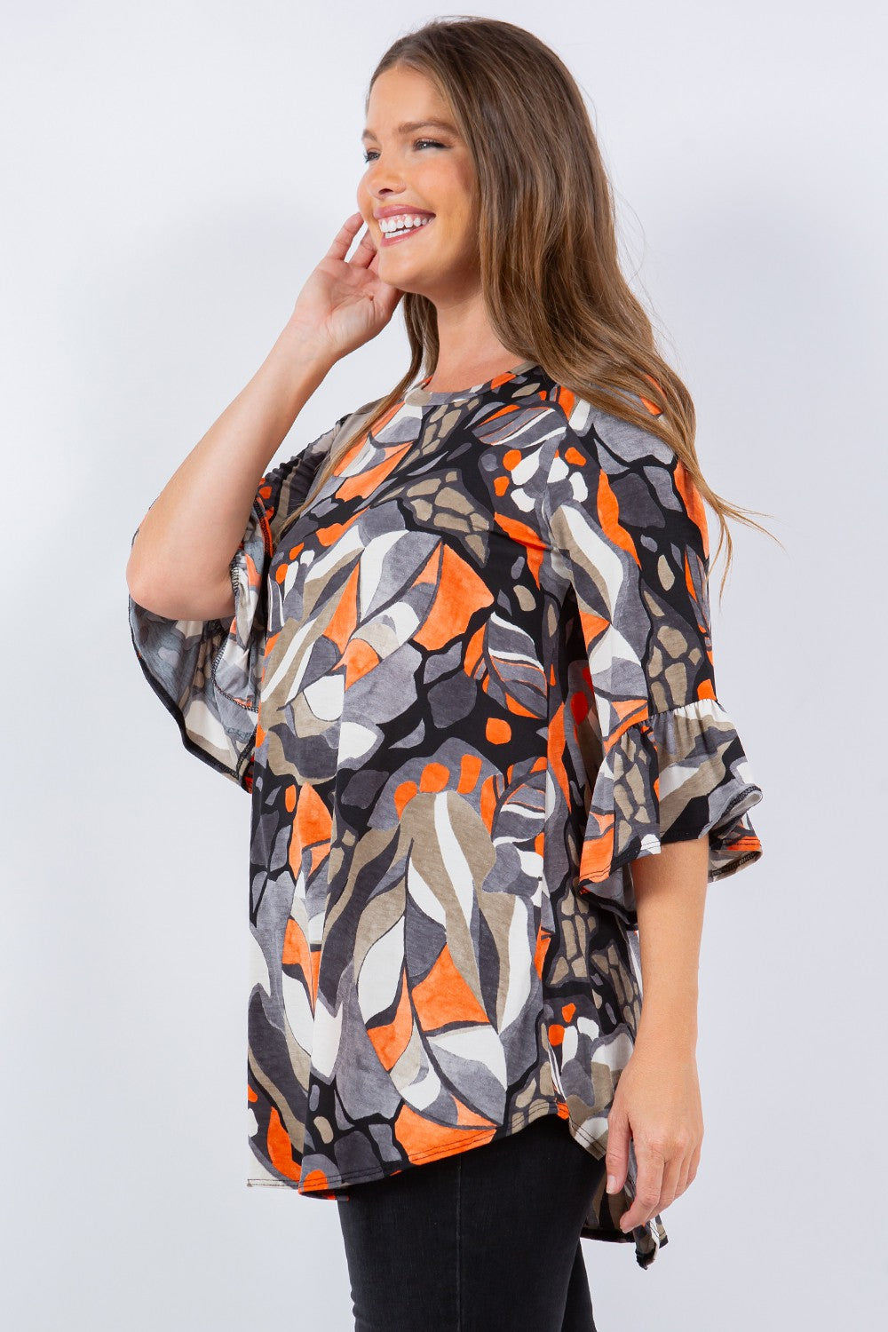 ORANGE ABSTRACT PRINT TUNIC TOP DETAIL ON THE SLEEVES