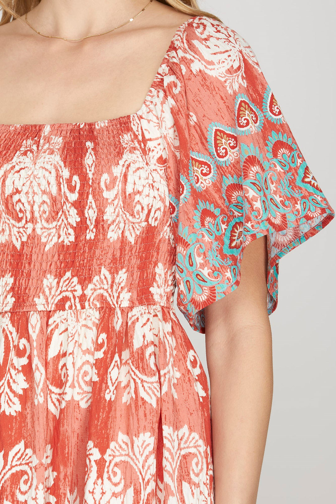 RED SMOCKED BORDER PRINT WOVEN MINI DRESS-SKSY8665