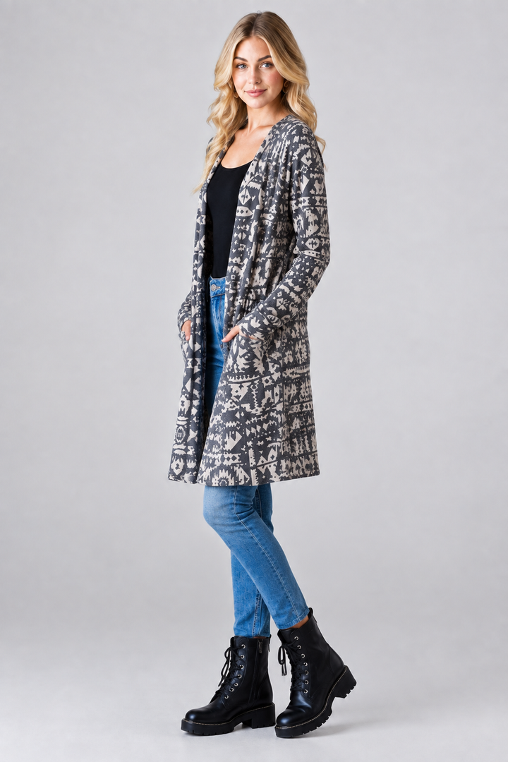 Aztec print cardigan, blonde model, side pose face forward, studio background