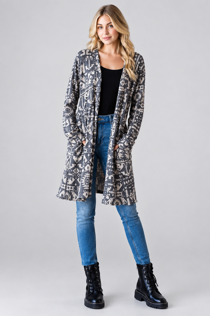 Aztec print cardigan with pockets, blonde model, studio background