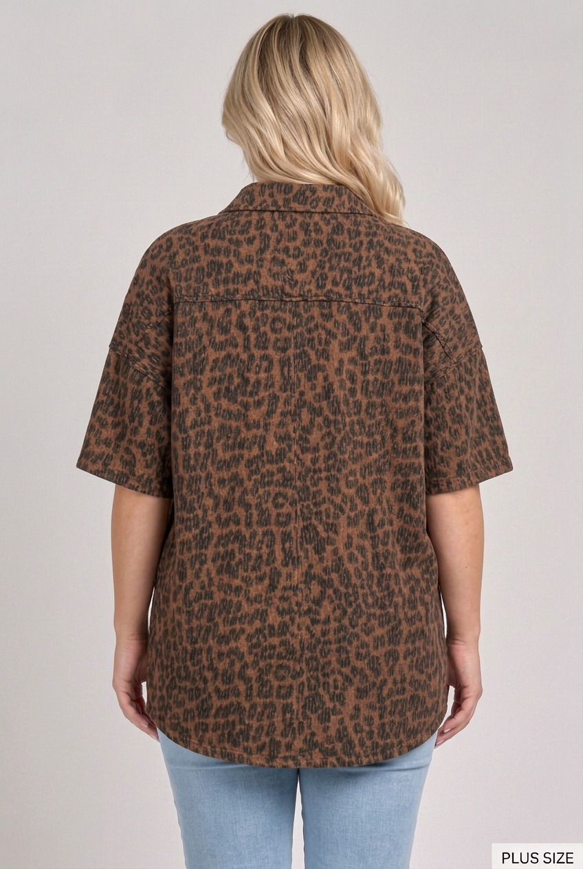 Back view of the plus-size blonde model wearing the dark leopard top