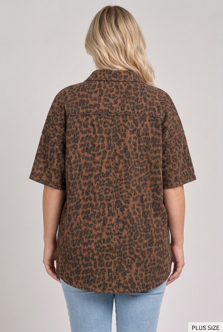 Back view of the plus-size blonde model wearing the dark leopard top