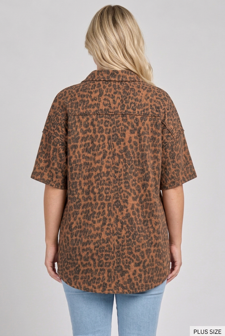 Back view of the plus-size blonde model wearing the leopard shirt