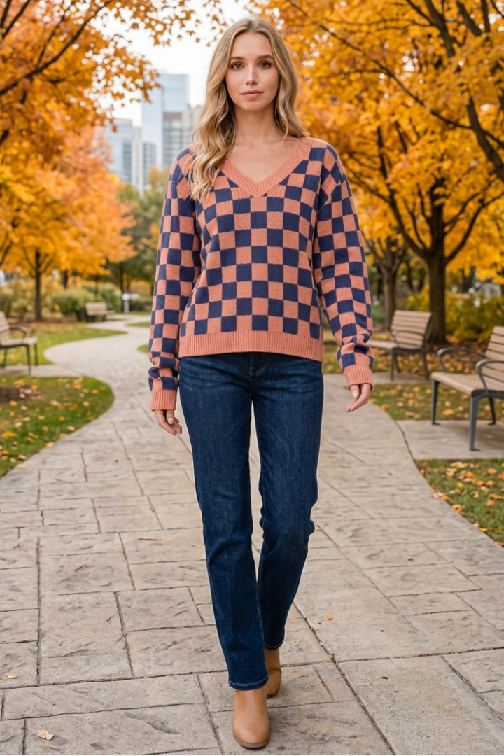Checkerboard sweater lifestyle view in an autumn park