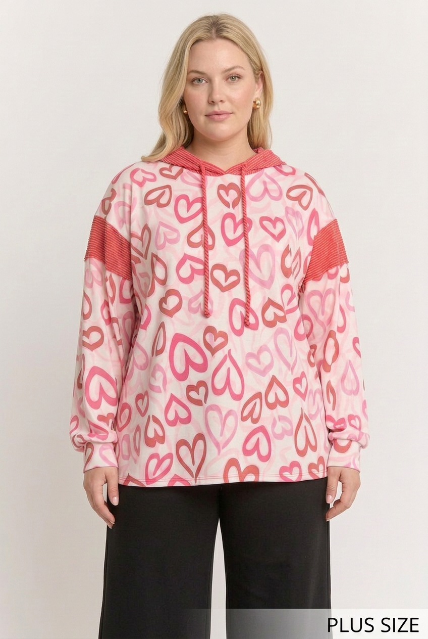 Curvier plus-size blonde model wearing the outlined-heart top