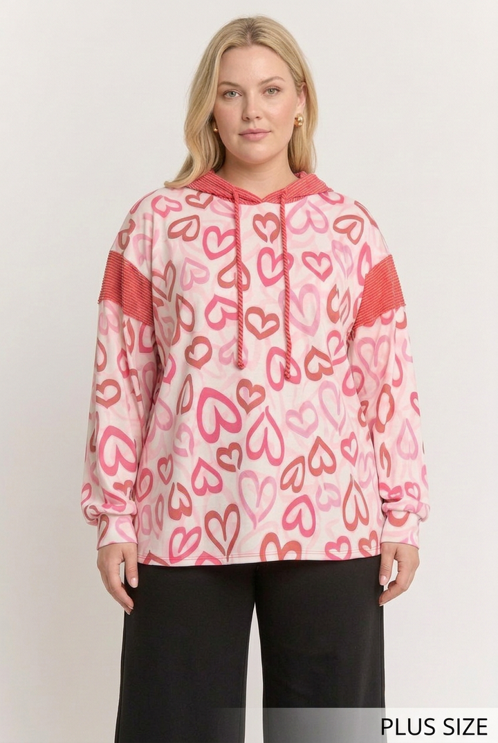 Curvier plus-size blonde model wearing the outlined-heart top