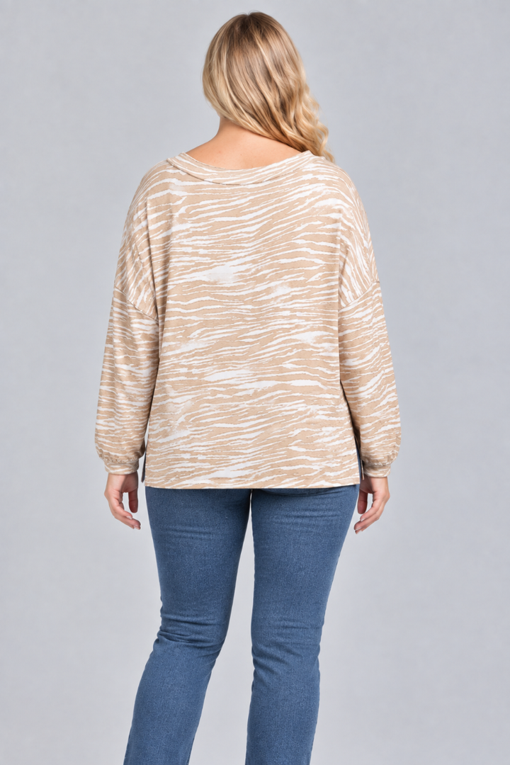 Full-back studio view of the blonde XL model wearing the taupe-and-cream top and blue jeans