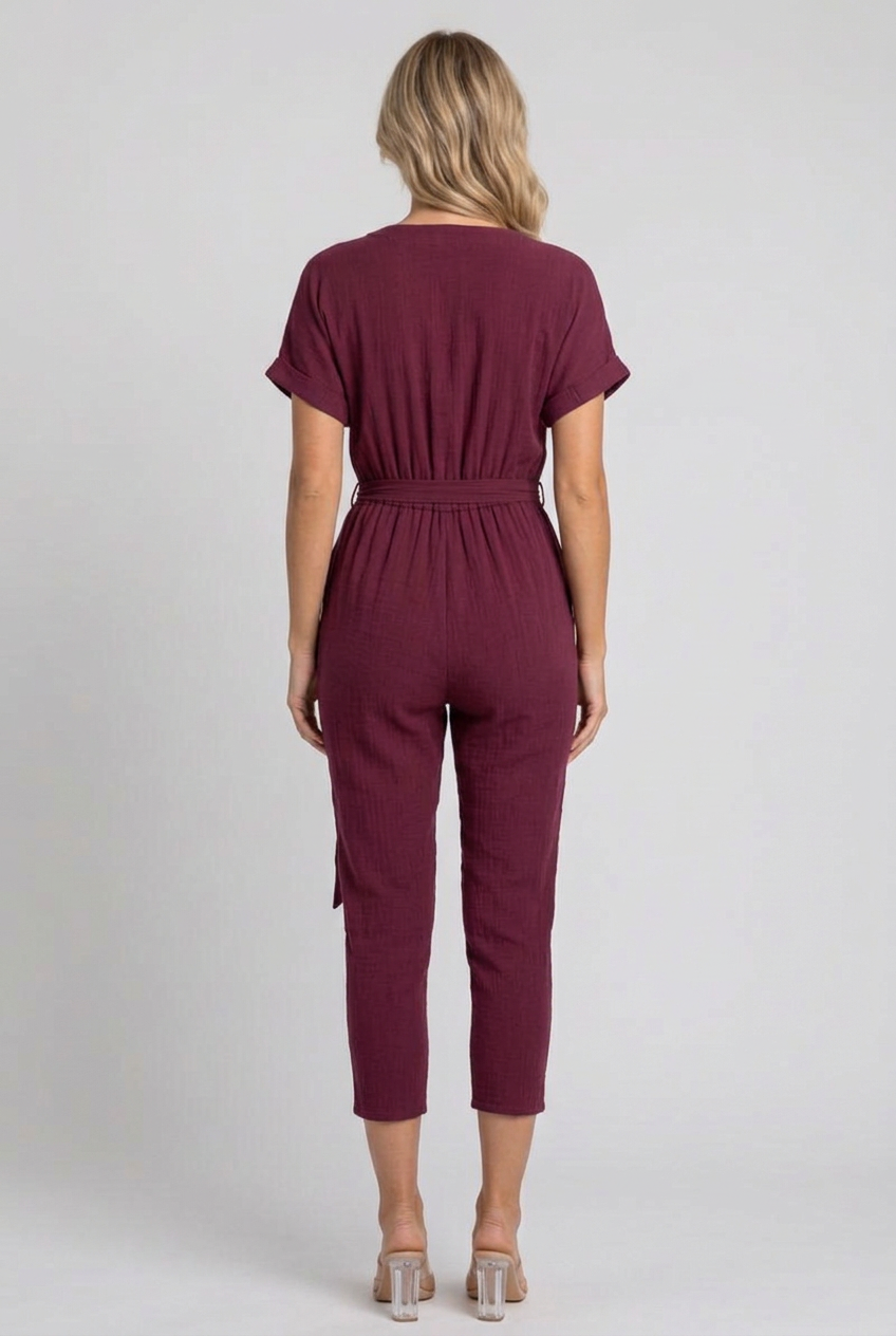 Full-back studio view of the burgundy cropped jumpsuit