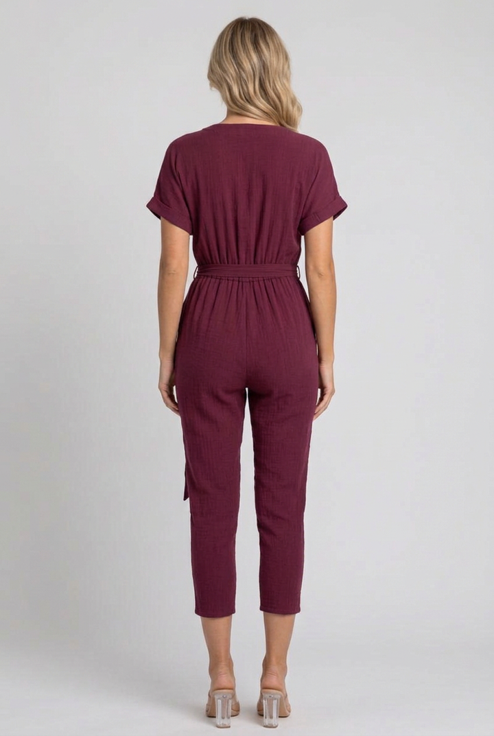 Full-back studio view of the burgundy cropped jumpsuit