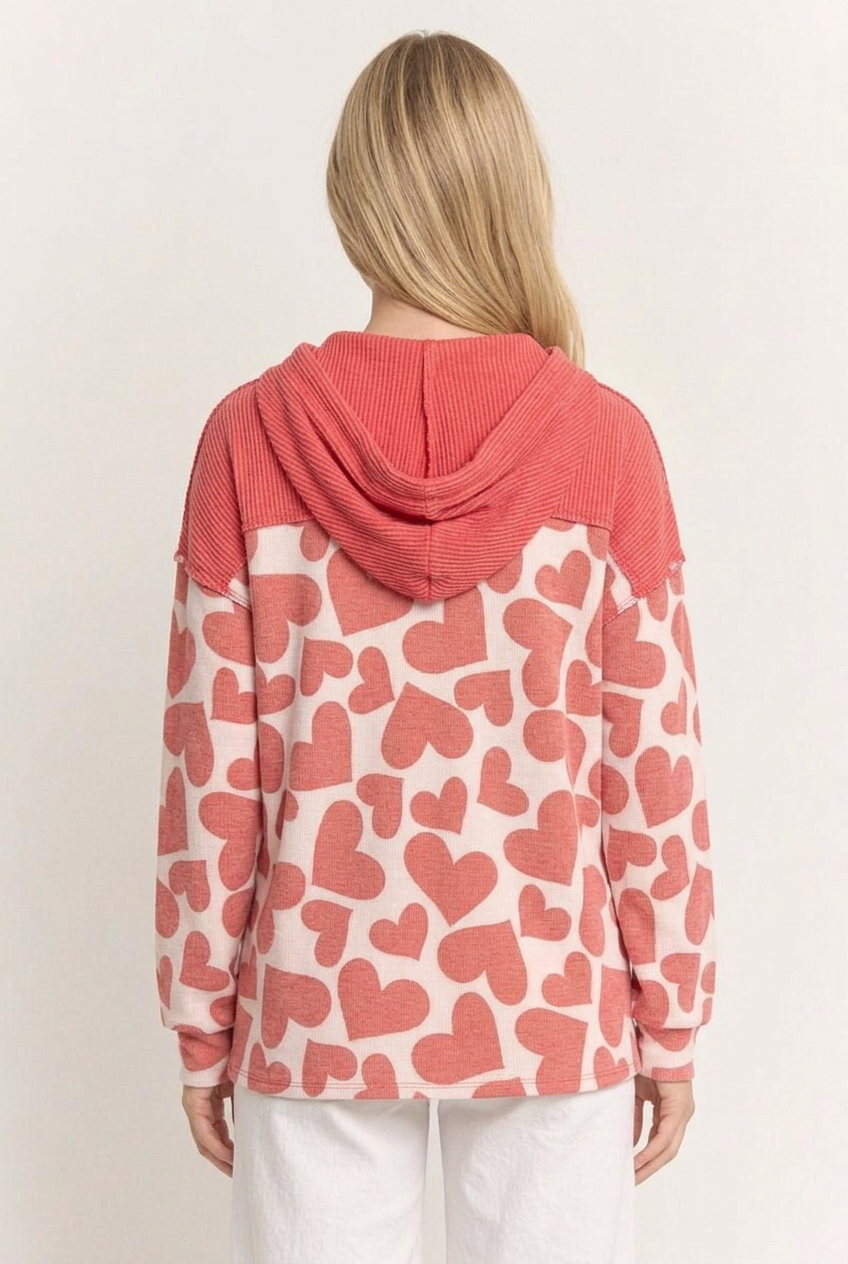 Full-back studio view of the heart-print top