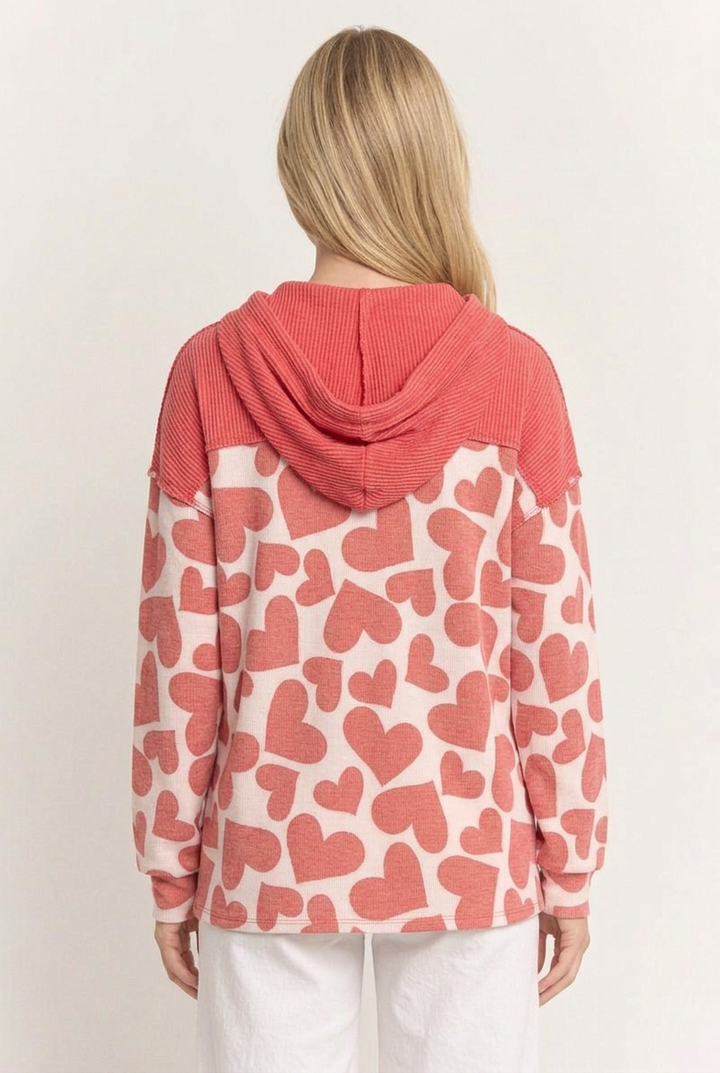 Full-back studio view of the heart-print top
