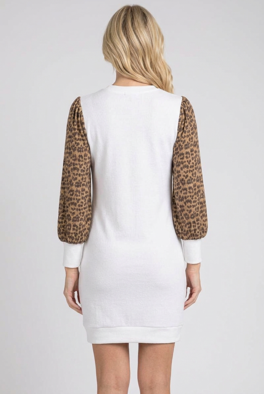 Full-back studio view of the white dress with leopard sleeves
