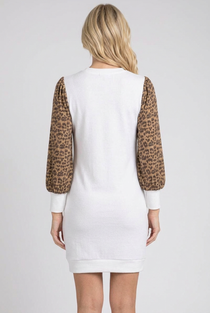Full-back studio view of the white dress with leopard sleeves