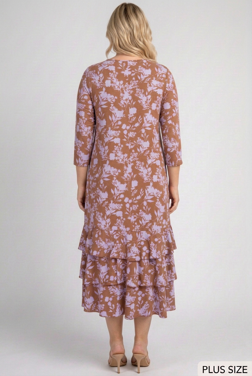 Full back view of the curvy blonde model in the floral dress