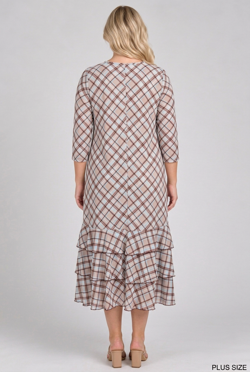 Full back view of the plus-size blonde model wearing the plaid dress