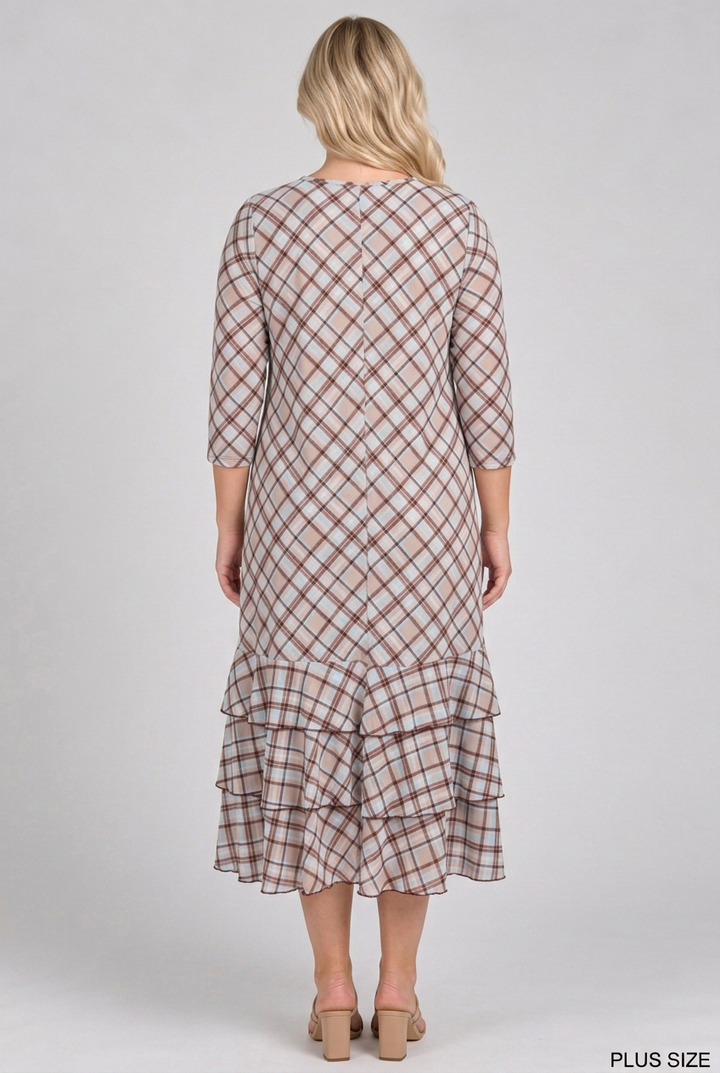 Full back view of the plus-size blonde model wearing the plaid dress