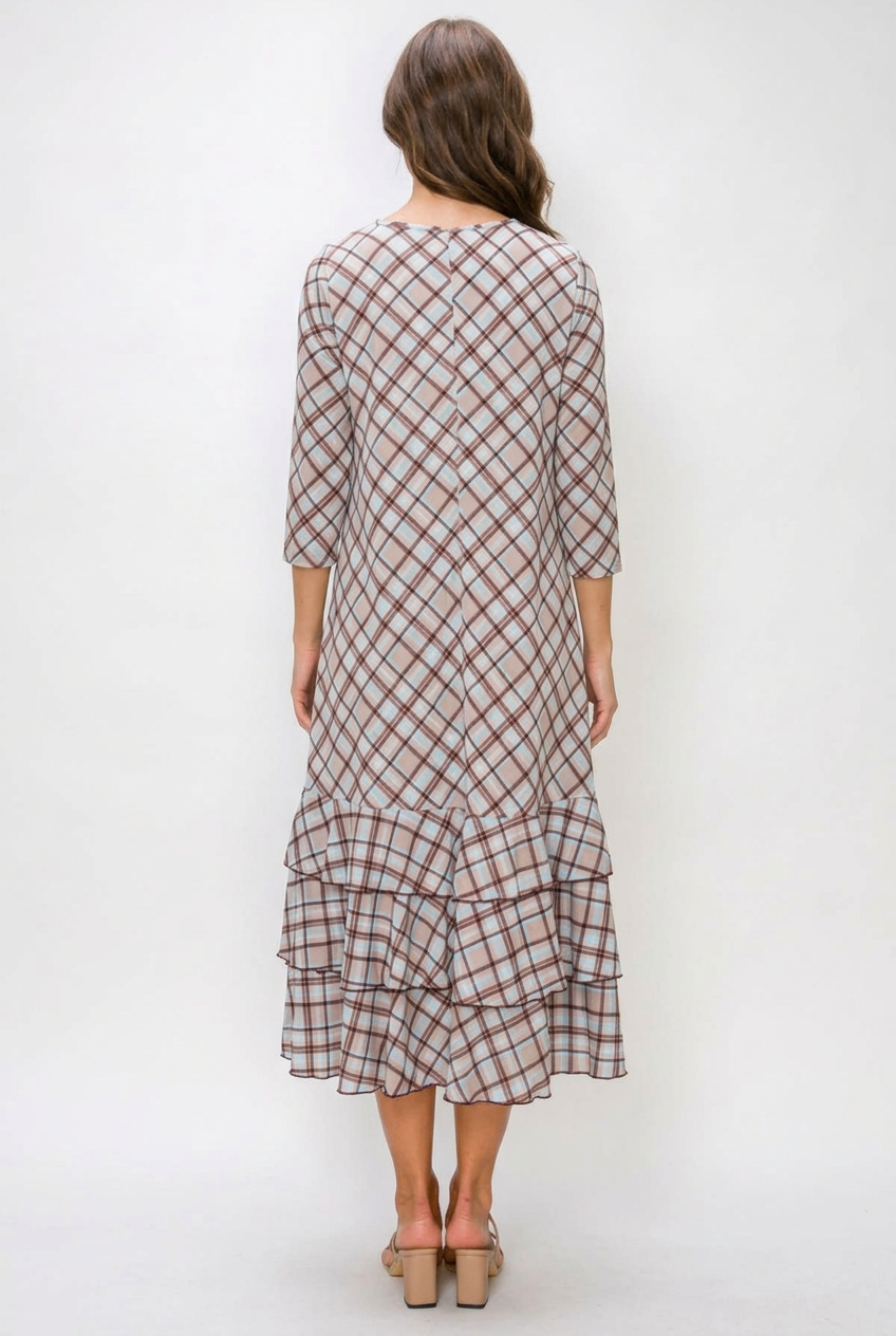 Full back view of the regular-size brunette model in the plaid dress