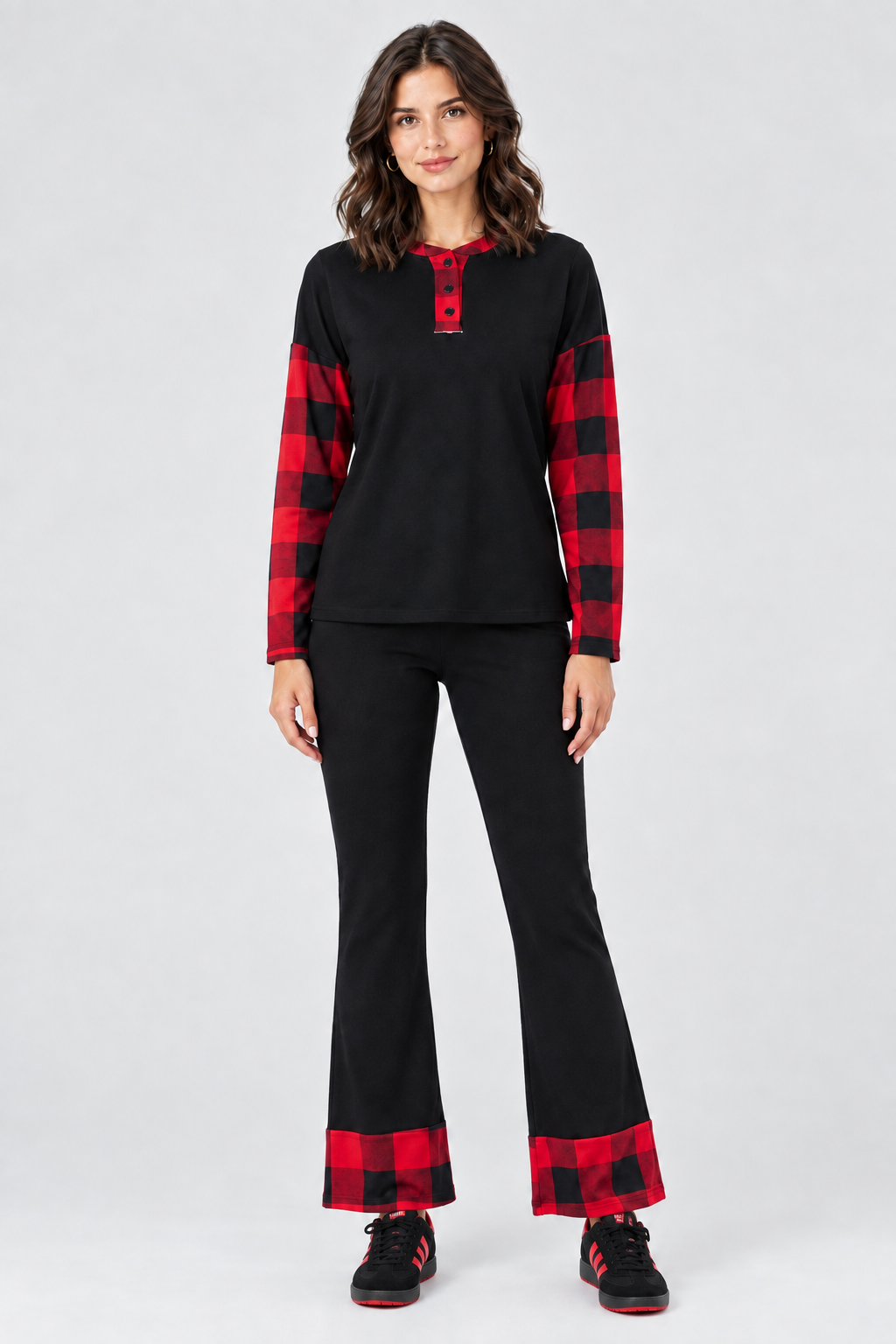 Full-body studio front view, black outfit with red plaid accents and coordinating black-and-red sneakers
