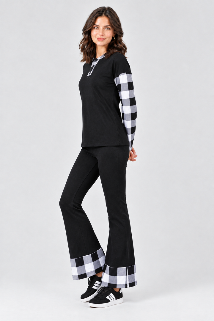 Full-body studio side view, black outfit with black-and-white plaid details, black sneakers with white accents
