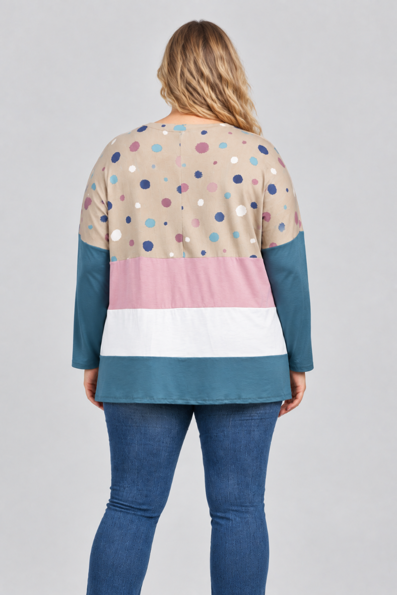 Hat-free studio back view of blonde model in dotted taupe color-block tunic and blue jeans