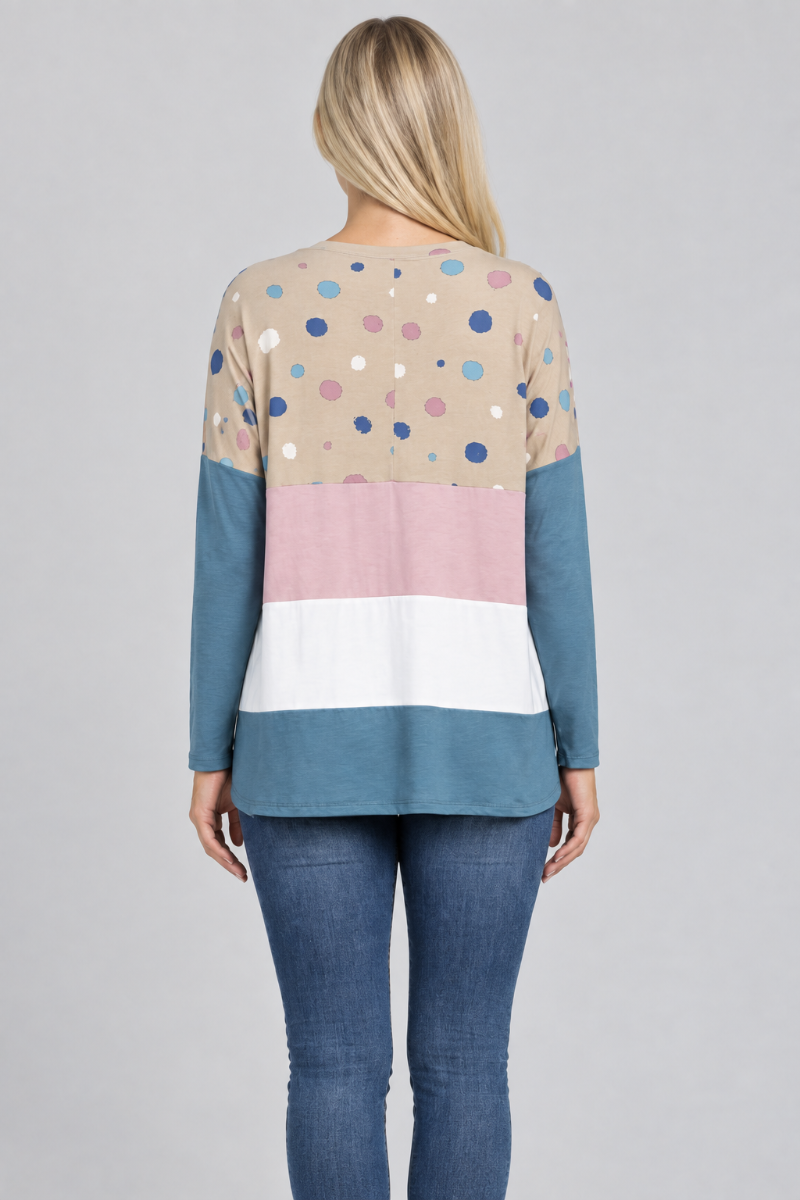 Hat-free studio back view of blonde model in taupe dotted color-block tunic and jeans