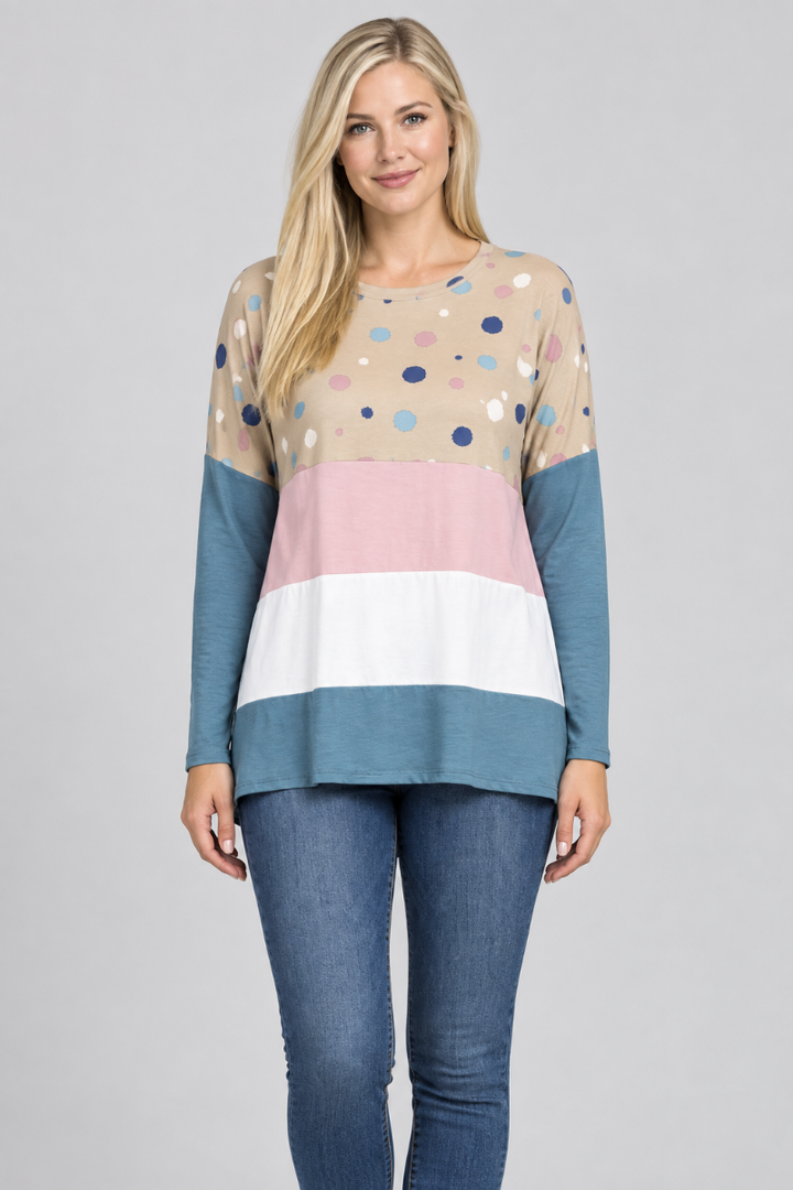 Hat-free studio front view of blonde model in taupe dotted color-block tunic and jeans