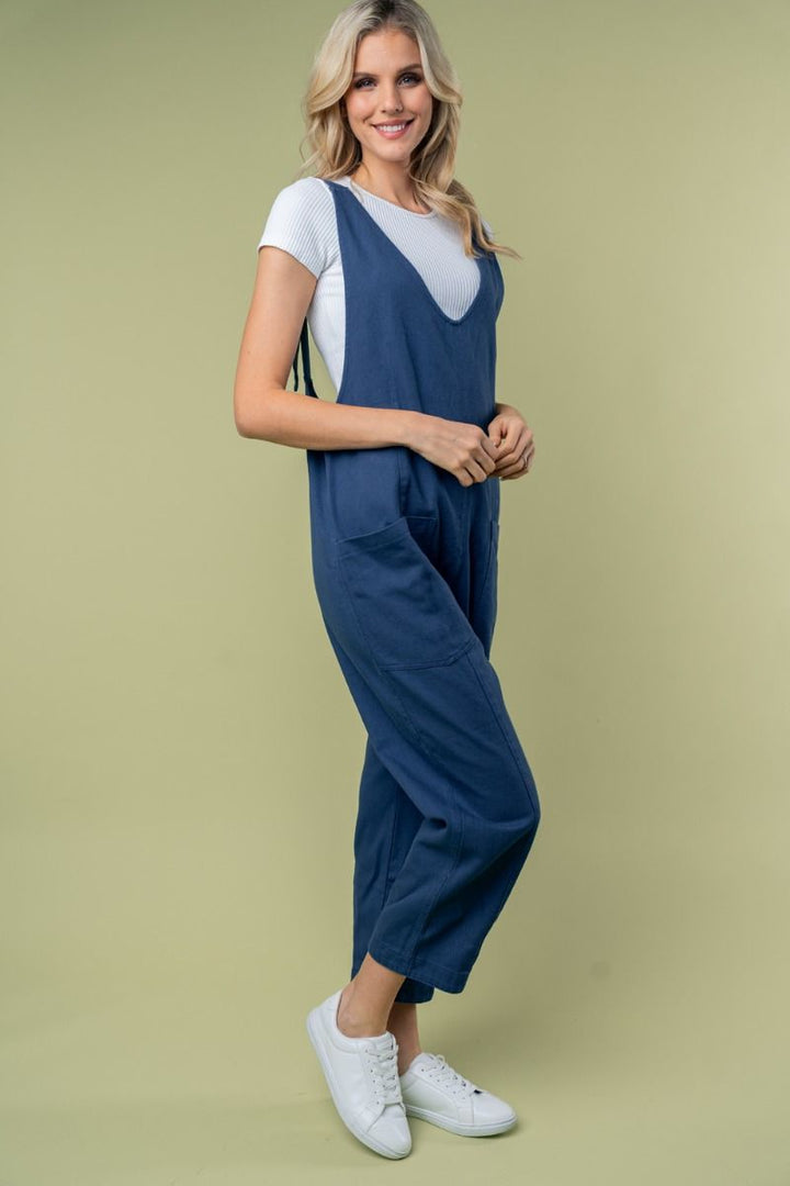 SLEEVELESS SOLID KNIT JUMPSUIT WITH SCOOP V-NECK