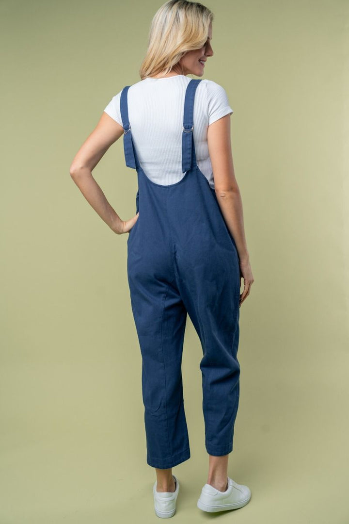 SLEEVELESS SOLID KNIT JUMPSUIT WITH SCOOP V-NECK