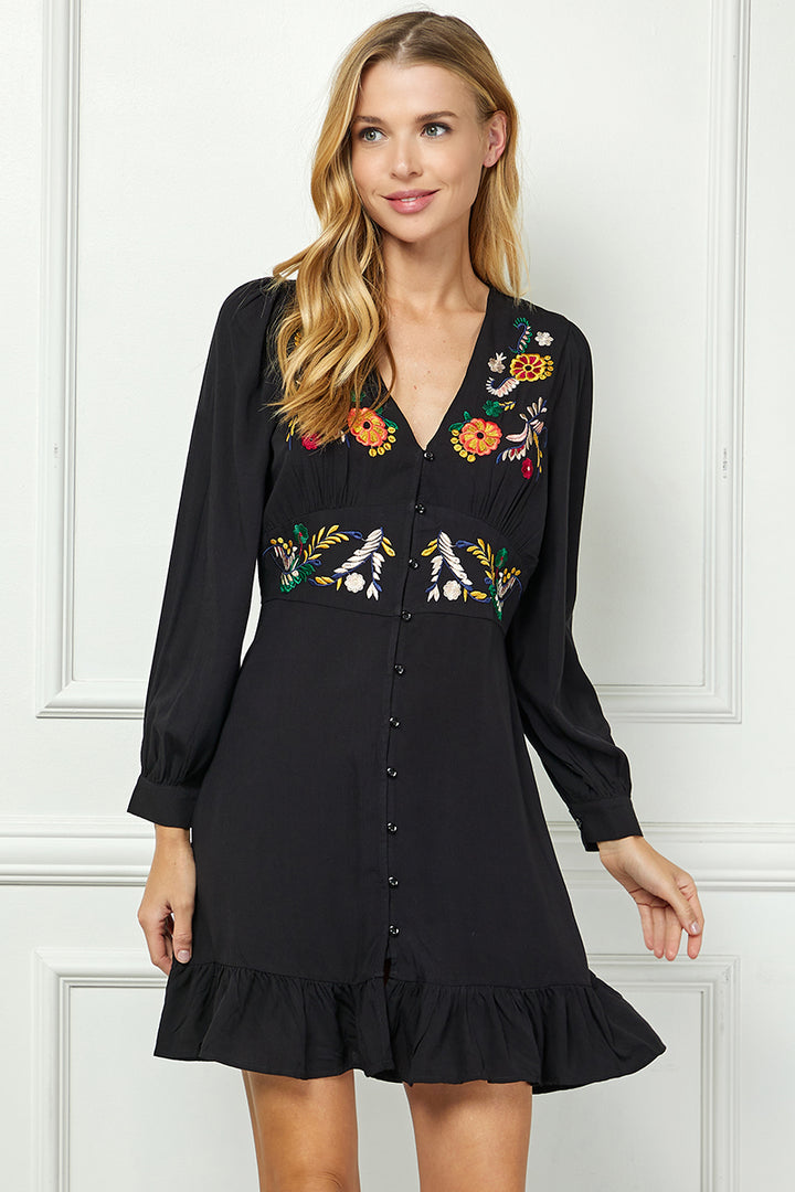 Long sleeve embroidered button down dress.