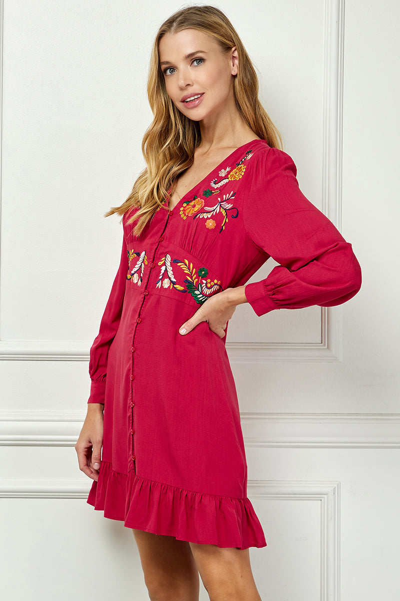 Long sleeve embroidered button down dress.