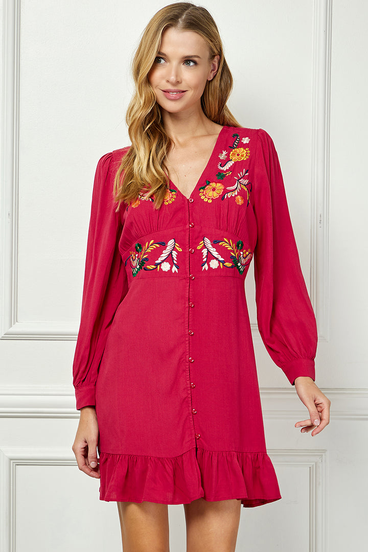 Long sleeve embroidered button down dress.