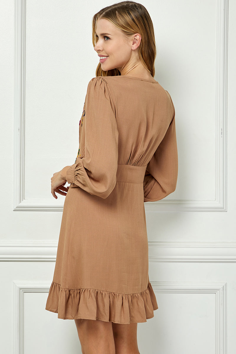 Long sleeve embroidered button down dress.