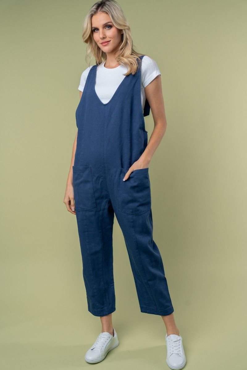 SLEEVELESS SOLID KNIT JUMPSUIT WITH SCOOP V-NECK