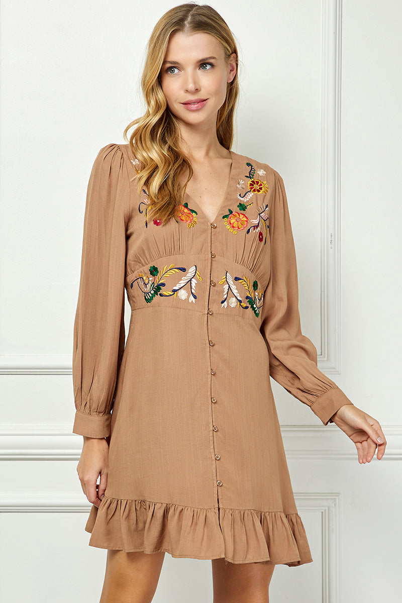 Long sleeve embroidered button down dress.