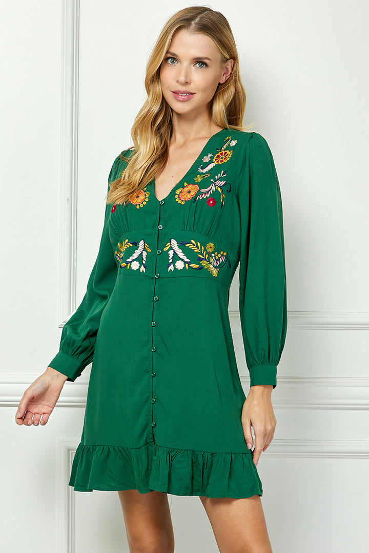 Long sleeve embroidered button down dress.