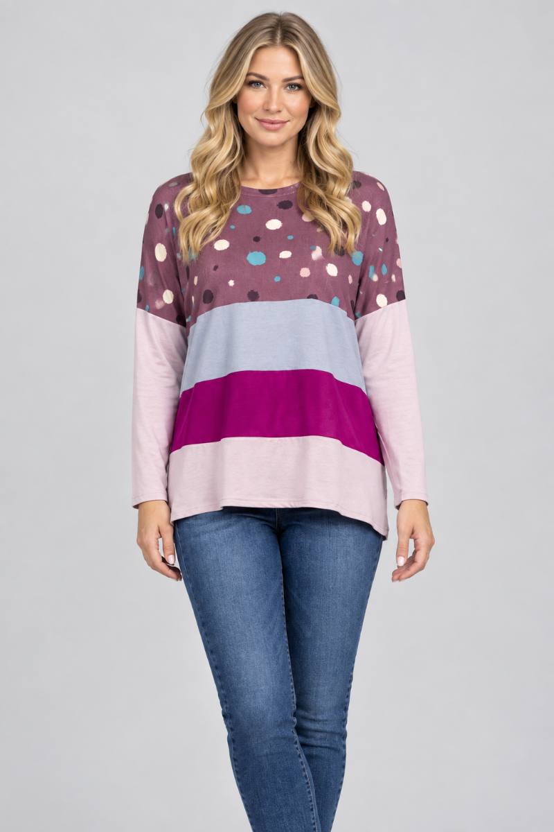New blonde model, hat-free, in the plum dotted color-block top