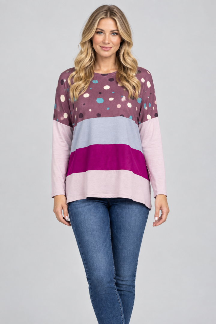 New blonde model, hat-free, in the plum dotted color-block top