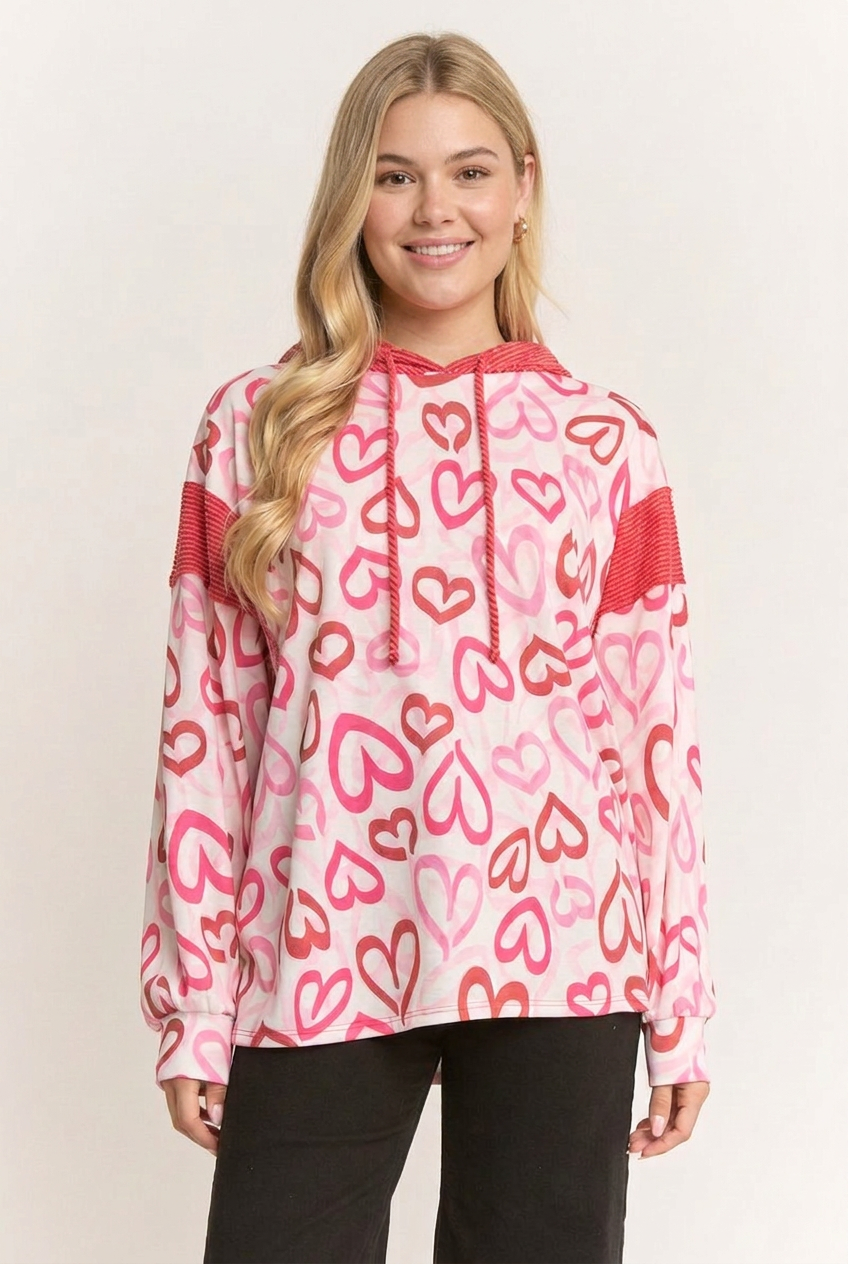 New-face revision of the blonde model wearing the outlined-heart top