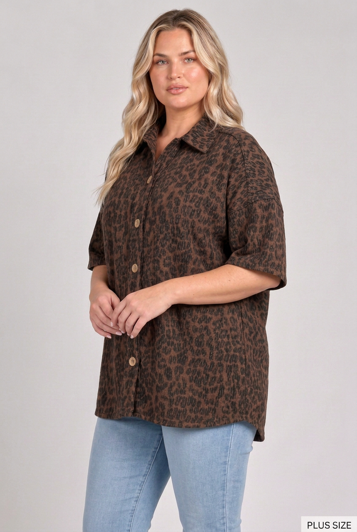Plus-size blonde model in a side pose wearing the dark leopard top