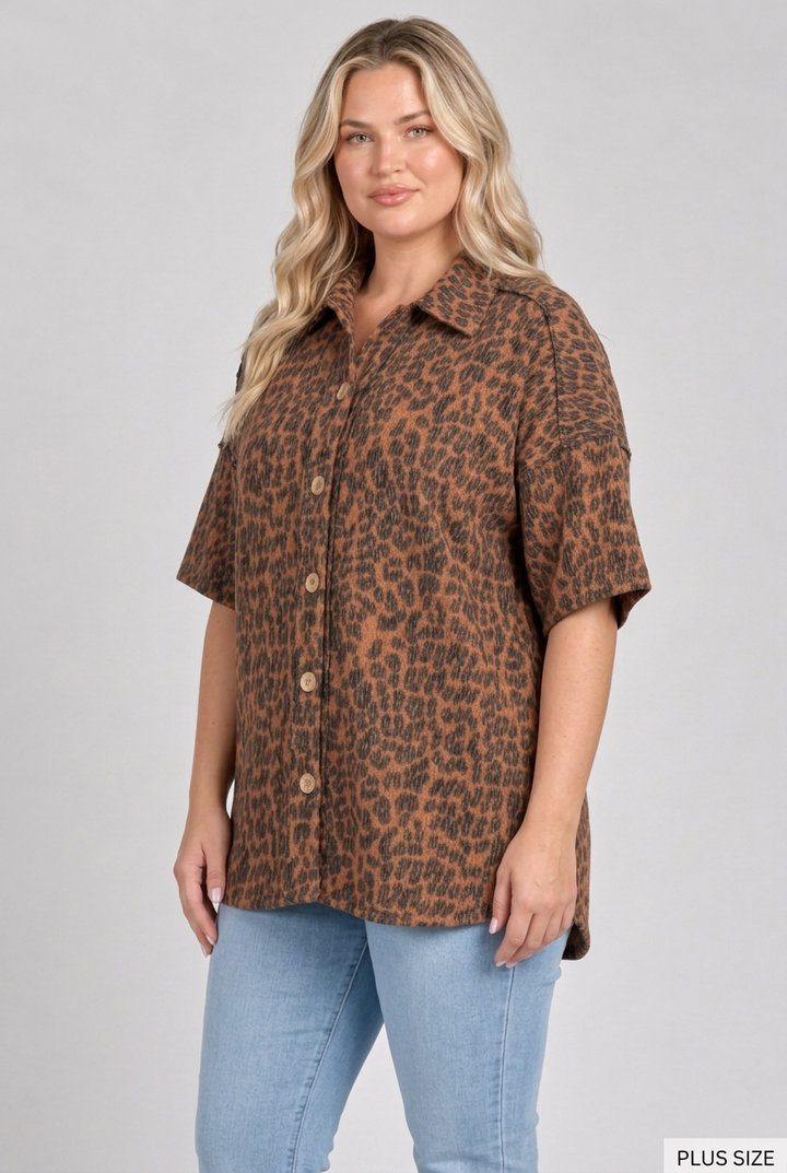 Plus-size blonde model in a side pose wearing the leopard shirt