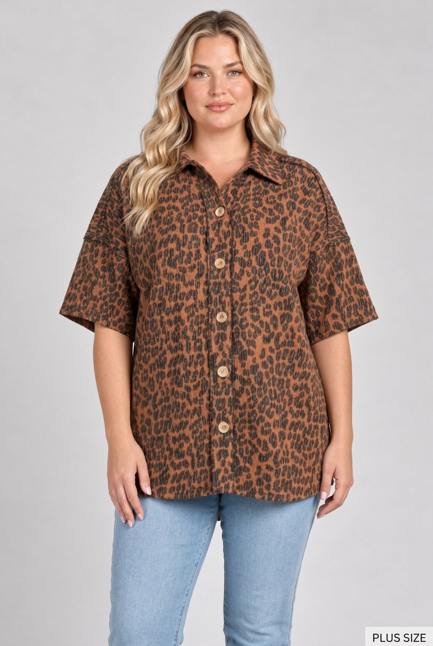Plus-size blonde model wearing the leopard shirt and light blue jeans