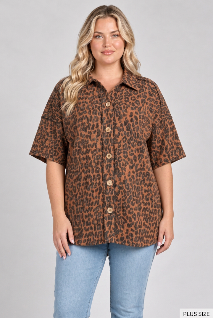 Plus-size blonde model wearing the leopard shirt and light blue jeans