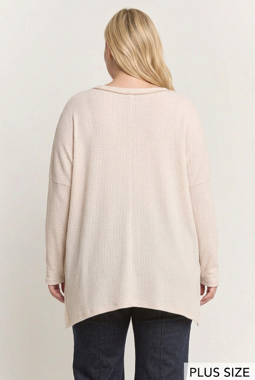 Plus-size full-back studio view of the ivory ribbed top