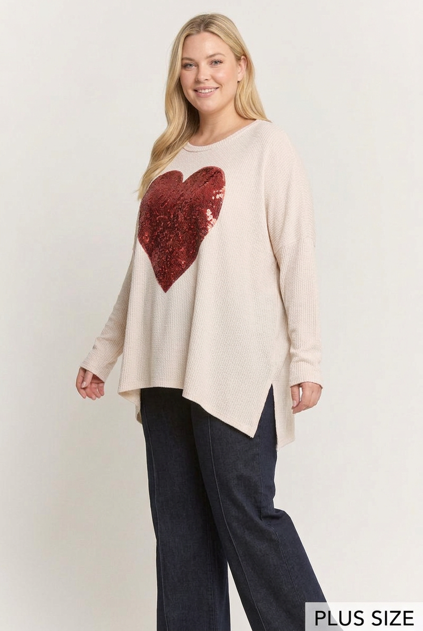 Plus-size side studio pose wearing the red sequin-heart top